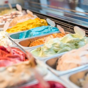 assorted flavor ice cream in display shelf selective focus photography